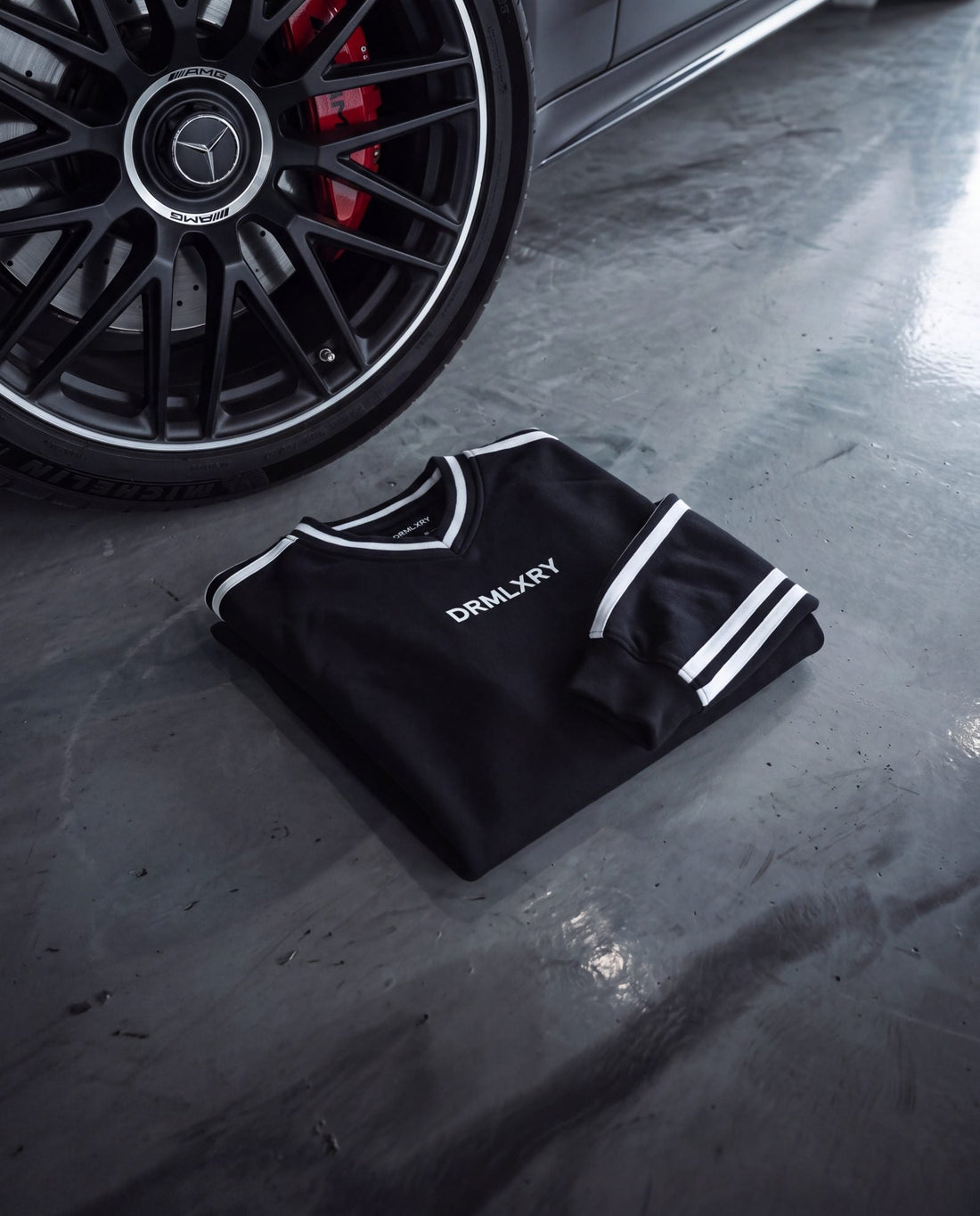 DRMLXRY outfit next to a Mercedes S63 wheel