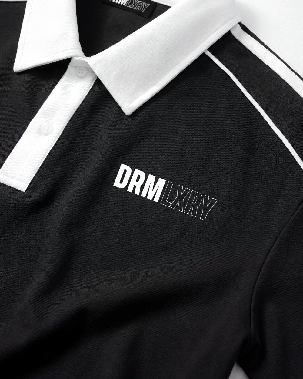 DRMLXRY Paddock Polo, print close-up